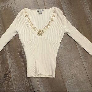 WD.NY Cream V-Neck ribbed sweater with gold, white and silver bead accents.